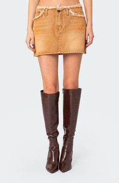 Sturdy meets flirty in a leggy denim miniskirt served with frayed edges and shaded in a sandy hue. Zip fly with button closure Front scoop pockets; coin pocket 100% cotton Machine wash, dry flat Imported Denim Miniskirt, Distressed Denim, Womens Bottoms, Camel, Coin, The 100, Mini Skirts, Nordstrom