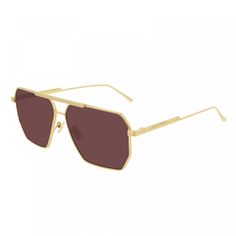 Step out in style with these luxurious Bottega Veneta BV1012S 005 Gold/Red sunglasses from OSSA FRAMES. Crafted with precision and attention to detail, these aviator-style frames are sure to elevate your look to new heights. The stunning gold frame exudes sophistication and elegance, making a bold statement wherever you go. Paired with vibrant red lenses, these sunglasses are not just a fashion accessory, but a work of art. The lens socket width of 60 ensures a comfortable fit for both men and w Bottega Sunglasses 2021, Luxury Elegant Beige Sunglasses, Luxury Brown Anti-reflective Sunglasses, Luxury Classic Beige Sunglasses, Luxury Beige Modern Sunglasses, Luxury Modern Beige Sunglasses, Luxury Brown Sunglasses For Travel, Classic Luxury Tan Sunglasses, Classic Luxury Brown Sunglasses