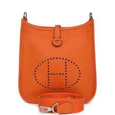 This Evelyne is in Orange clemence leather with palladium hardware and has tonal stitching, pull tab top closure and an Orange Minium removable canvas and leather shoulder/crossbody strap.The interior is lined with Orange natural leather.Collection: BOrigin: FranceCondition: New and never (plastic on hardware)Accompanied by: Hermes box, Hermes dustbag, shoulder strap, shoulder strap dustbag, ribbon and carebookMeasurements: 6.75" width x 7" height x 2" depth; 23" strap dropDelivery 5-8 or 10-15 working days Please note that during high season and Sale period, delivery times may be affected We accept payment with a Credit card, Debit card, or PayPal.Note: Our Items are totally New High quality Brand Inspired Refurbished. Please make sure you are well aware of it before buying any of the Ite Hermes Evelyne Tpm, Monogram Neverfull, Hermes Box, Sneaker Jewelry, Burberry Shoes, Backpack Tote Bag, Handbag Wallet, Carry All Bag, Wallet Accessories