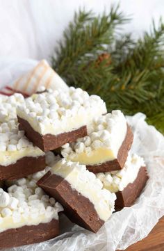 several pieces of chocolate and marshmallows are stacked on top of each other