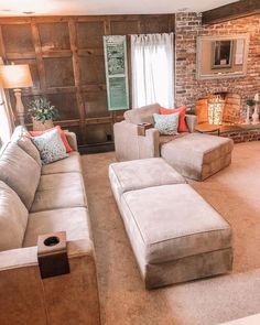 a living room filled with furniture and a fire place next to a wall mounted tv