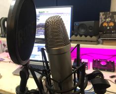 a microphone sitting in front of a laptop computer