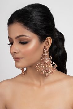 22k rose gold plated chandeliers with embellished pearls, encrusted cubic zirconia stones and carved leaf motifs.
Type: Pearl, Cubic Zirconia
Color: Gold
Leaf- floral motifs
Carved detail
Plated with 2 microns of 22k gold and 2 microns of lacquer
 - Aza Fashions Elegant Kundan Jeweled Chandelier Earrings, Luxury Chandelier Earrings For Festive Occasions, Luxury Festive Chandelier Earrings, Elegant Kundan Chandelier Earrings With Dangling Beads, Elegant Pearl Drop Chandelier Earrings For Reception, Elegant Kundan Bridal Earrings With Dangling Beads, Elegant Jewelry With Dangling Beads For Reception, Elegant Rose Gold Chandbali Jewelry, Elegant Reception Jewelry With Dangling Beads