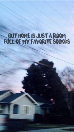 a blurry photo of a house with the words out home is just a room full of my favorite sounds