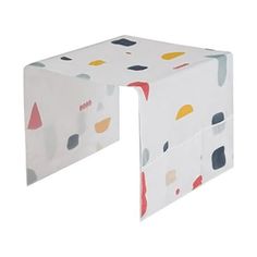 a white table with colorful shapes on it