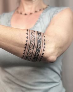 a woman with a tattoo on her arm