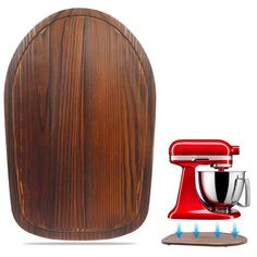 a red mixer next to a wooden cutting board and stand mixer on a white background