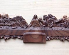 a wooden carving depicting the last supper of jesus