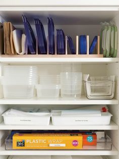 the shelves are filled with plastic containers and other items to keep things organized on them