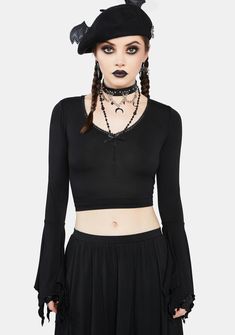 cuz you're the coolest one in the colony. This cropped top has bat wing graphics printed at back, long sleeves with handkerchief cuffs, a lace-trimmed neckline, and a bow applique at the bust. Gothic Stretch Crop Top, Gothic Stretch Cropped Crop Top, Punk Style Long Sleeve Stretch Crop Top, Punk Style Cropped Stretch Tops, Punk Style Stretch Cropped Tops, Gothic Long Sleeve Tops For Spring, Edgy Stretch Long Sleeve Crop Top, Spring Gothic Stretch Crop Top, Stretch Cropped Punk Tops