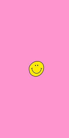 a yellow smiley face on a pink background