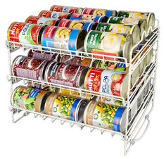 an organized spice rack with canned food on top and cans in the bottom tiers