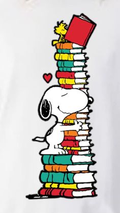 a stack of books with a cartoon character leaning on it's head and holding a red book