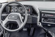 the interior of a car with dash lights and gauges