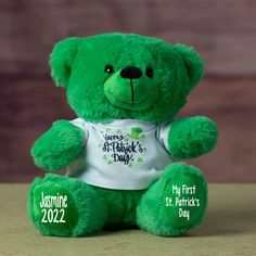 a green teddy bear wearing a t - shirt that says happy st patrick's day