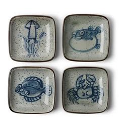 four blue and white plates with cartoon drawings on the front, one is holding an umbrella