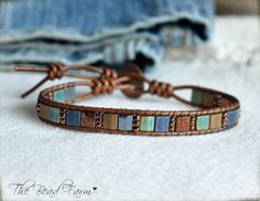 "Tile Bead Wrap Bracelet, Tila Wrap, Leather Beaded Wrap, Women's Boho Wrap Bracelet This beaded wrap bracelet features genuine Japanese Miyuki 5mm tila beads in a variety of colors and finishes that are oh, so deep and rich! You'll be the recipient of many compliments! The beautiful tile beads are securely hand-stitched to leather using strong and durable Fireline beading thread. The leather is a supple 1.5mm distressed brown. The bracelet will wrap once around your wrist and close with a small Adjustable Hand-wrapped Beaded Leather Bracelet, Beaded Multi-strand Wrap Bracelet, Bohemian Brown Leather Wrap Bracelet, Adjustable Multi-strand Wrap Bracelet With 108 Beads, Loomed Bracelets, Farm Jewelry, Tila Bracelets, Bead Wrap Bracelet, Gemstones Chart