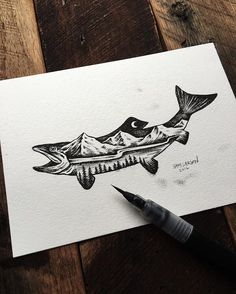 an ink drawing of a fish with mountains in the background and a pen resting on it