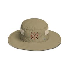 a tan hat with crossed swords on it