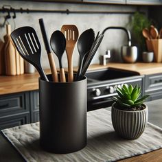 utensils in a cup on a kitchen counter