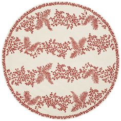 a round rug with red flowers and leaves on white background, in the shape of a circle