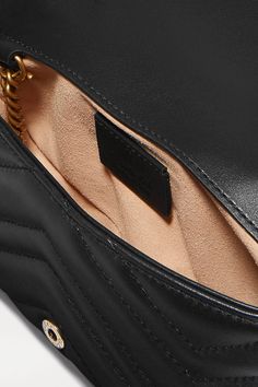 Black GG Marmont super mini quilted leather shoulder bag | GUCCI | NET-A-PORTER Marmont Super Mini, Gucci Top, Bag Gucci, Gucci Gg Marmont, Gg Marmont, Iconic Bags, Mini Quilt, Quilted Leather, Net A Porter