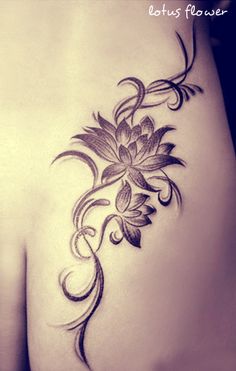 the back of a woman's stomach with flowers on it