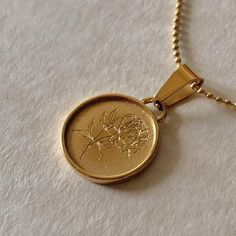 Made in Canada A beautiful gold coin necklace is perfect for stacking and summer. 2 choices of engraving. The sun represents life, positivity, and clarity or the Fleur De Pivione Necklace Aka, the Peony. Chain Length: 18 inches plus a 2-inch extension included. Pendant Size: 15mm💦 Water Resistant & Anti Tarnish Pictured with: Sun Coin Necklace Introverted Extrovert, Birthstone Charm Necklace, Extroverted Introvert, Gold Coin Necklace, Gold Engraving, Sell Gold, Gold Coin, Zirconia Earrings, Coin Necklace