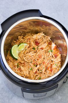 the food in the slow cooker is ready to be eaten and served for lunch