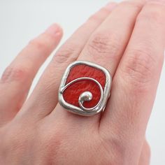 "Opaque, bright red textured stained glass ring edged in silver, and accented with a silver wire swirl. The sterling silver wire band is size 9. This is a one of a kind ring.  Ring Size: US 9 / UK R 1/2 Center Glass Size: 7/8\" x 3/4\" Each item by Faerie Glass is 100% uniquely hand-crafted with quality materials that are lead-free. NOTE - All photographs are taken in effort to best represent the actual product. Color of actual jewelry may vary slightly from photographs." Stained Glass Ring, Hot Tamale, Stained Glass Earrings, Red Beaded Bracelet, Hot Tamales, Stained Glass Butterfly, Stained Glass Jewelry, Nugget Necklace, Glass Ring