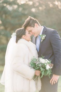 a bride and groom pose for a wedding photo