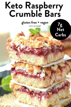 keto raspberry crumble bars stacked on top of each other with text overlay