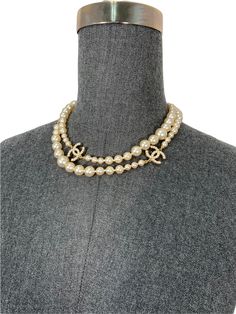 We the ity of this rare Chanel CC Logo Timeless Classic Faux Pearl Necklace crafted from graduated?ÿwhite faux pearls?ÿand gold-tone hardware. Featuring signature 'CC' encrusted logo's and a lobster clasp closure. Wear this?ÿversatile necklace long or doubled! Condition:?ÿExcellent.?ÿOverall like-new. All pearls and encrusted 'CC' logos are in-tact and perfect. Graduating faux pearls?ÿ Gold-tone metal hardware 17'' drop?ÿ Total?ÿlength, 34'' 'CC' logos, 0.75'' Chanel Cc Pearl Necklace, Chanel Pearl Chocker, Chanel Classic Pearl Necklace, Chanel Cc Necklace Gold, Cc Pearl Necklace, Shopping Chanel, Necklace Craft, Ball Pendant, Faux Pearl Necklace