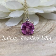 "The pendant pictured is lab created pink sapphire #6673. -Approximate total carat weight: 2.75ctw diamond equivalent -Stone Size: 9mm approx. 2.70ct diamond equivalent -Stone Shape: octagon/web cut -Gem Type: lab created pink sapphire -Stone Color: Pink -Stone Clarity: VS2 -Moh's Scale: 9 hardness Accent Stone -Stone Size: approx. .03ctw -Stone Shape: round -Gem Type: Diamond -Stone Color: G -Stone Clarity: SI1 -Moh's Scale: 10 hardness -Metal Type and Purity: 14k yellow gold -Setting: basket h Dazzling Pink Gemstone Jewelry, Pink Diamond Jewelry With Prong Setting, Fine Jewelry With Pink Sapphire, Dazzling Oval Pink Sapphire Jewelry, Rose Gold Jewelry With Pink Sapphire And Diamond Accents, Rose Gold Jewelry With Diamond Accents And Pink Sapphire, Pink Jewelry With Prong Setting For Anniversary, Rose Gold Jewelry With Brilliant Cut Pink Sapphire, Pink Prong Setting Jewelry For Anniversary