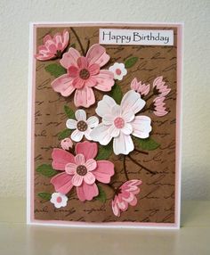 a birthday card with pink and white flowers