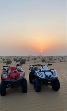 two four wheelers in the desert at sunset