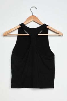 Lulus Exclusive! The Lulus Everyday Essential Black Ribbed Racerback Tank Top will be your BFF every day of the week! Simple yet chic, this basic top makes styling a snap thanks to a classic tank design with a sleeveless cut, scoop neck, and racerback. The cropped fitted silhouette is composed of soft and stretchy ribbed knit, which means it's just as comfy for lounging at home as it is for a spur of the moment adventure! Fit: This garment fits true to size. Length: Size medium measures 19.50" f Everyday Racerback Tops With Built-in Bra, Black Tank Top With Built-in Bra And Scoop Back, Chic Workout Tank Top, Basic Racerback Top For Everyday, Chic Tank Top For Workout, Chic Solid Color Tank Top With Scoop Back, Chic Scoop Neck Workout Tops, Black T-back Top For Spring, Black Scoop Back Tank Top For Workout