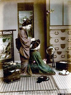 the woman is getting her hair done in an old fashion photo by mirror and dressers