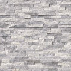 a white brick wall that is made out of grey marble bricks and has no mortars or mortars on it