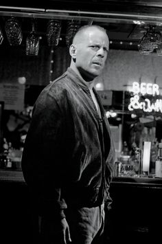 a man standing in front of a bar