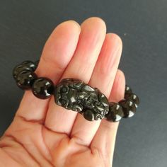 ** This Bracelet are made of      12 or 10 mm . Black Jade beads.      Hand carved beautiful  Jade pixiu. **Pixiu is one of the most.     popular Feng shui celestial     Animal. Pixiu is symbol to      protect luck, wealth, good      fortune and happiness      will company with you. ** Pixiu size 35*20 with 12       mm beas .      Pixiu size 30*20 mm with      10 mm beads. Feng Shui Dragon, Pixiu Bracelet, Black Jade, Jade Bracelet, Jade Beads, Feng Shui, Good Luck, For Everyone, Hand Carved