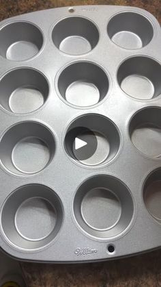 a metal muffin pan sitting on top of a counter