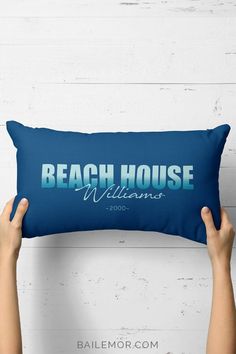 someone holding up a pillow that says beach house williams