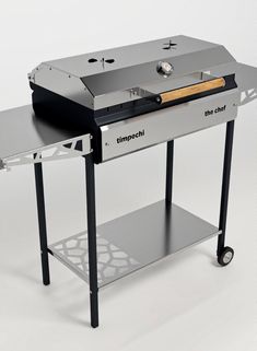 an image of a grill with wheels on it