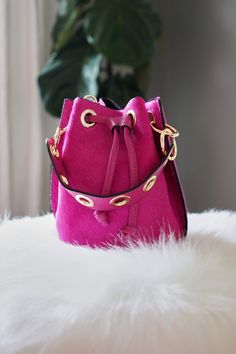 Fritz Bucket Bag Magenta - The Flaunt Rectangular Bucket Bag With Brass Hardware, Chic Crossbody Bucket Bag, Chic Leather Bucket Bag With Brass Hardware, Leather Shoulder Bag With Palladium Hardware, Bucket Bag With Brass Hardware For Daily Use, Luxury Bucket Bag Clutch With Gold-tone Hardware, Luxury Clutch Bucket Bag With Gold-tone Hardware, Chic Crossbody Bags With Brass Hardware, Pink Leather Crossbody Clutch