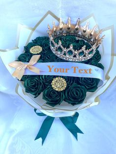 a bouquet of roses with a tiara on top that says your text in gold lettering