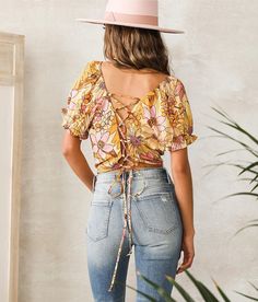 Angie Vintage Floral Cropped Top - Yellow Medium, Women's Mustard Printed square neck elasticized top Puff sleeves Back lace-up detail Bust measures 33 on size small Body length 17 on size small Model Info: Height: 5'7 | Bust: 30 1/2 | Waist: 23 | Hip: 35 | Wearing Size: Small. 100% Rayon. Hand wash cold. Do not bleach. Drip dry. Low iron if needed.. Measurements: Bust -Fullest part of bust with arms at sides. Waist -Circumference of natural waist: above belly button below rib cage. Hips -Standi Yellow Floral Print Crop Top For Spring, Vibrant Yellow Floral Print Tops, Vintage Yellow Floral Print Tops, Fitted Yellow Floral Print Crop Top, Bohemian V-neck Crop Top With Floral Print, Rib Cage, Drip Dry, Best Jeans, Women Shirts Blouse