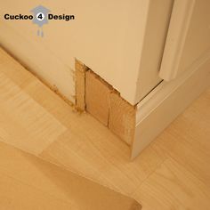 the corner of a room with wood flooring