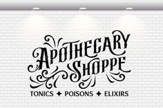 the words apothecary and shoppe on a white brick wall with spotlights