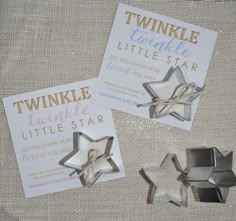 two little star shaped cookie cutters sitting next to each other on top of a table